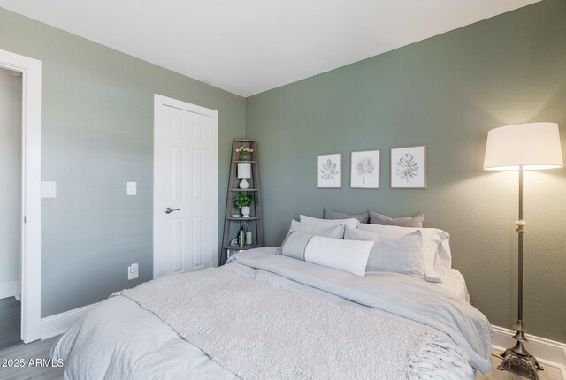 4313 E Briarwood Ter, Phoenix, AZ 85048 - bedroom with baseboards and wood finished floors