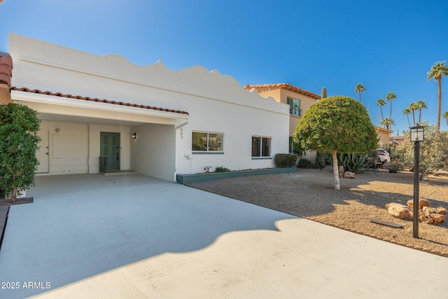 back of house featuring stucco siding