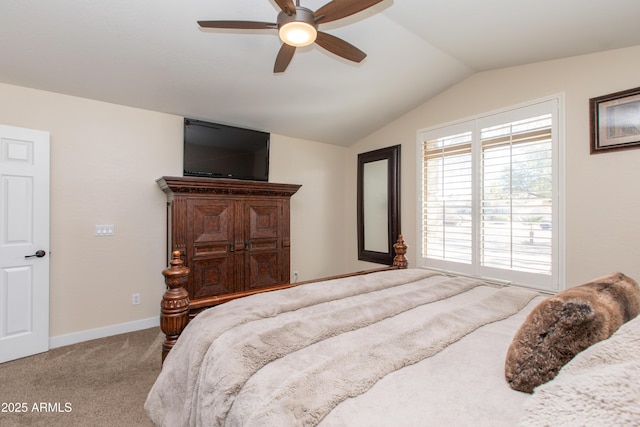 carpeted bedroom with ceiling fan and lofted ceiling