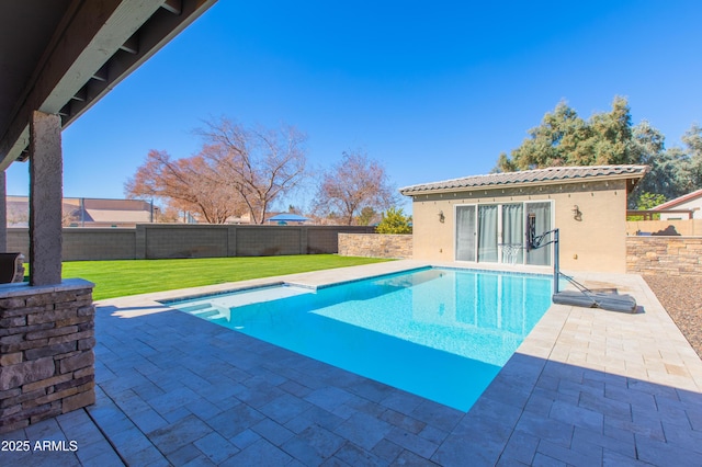 view of swimming pool featuring a patio area and a yard