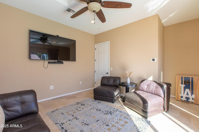 tiled living room with ceiling fan