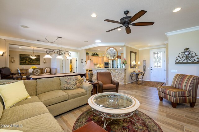 living room with pool table, ornamental molding, built in features, and ceiling fan