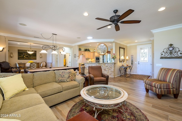 living area featuring light wood-style floors, ceiling fan, crown molding, and recessed lighting