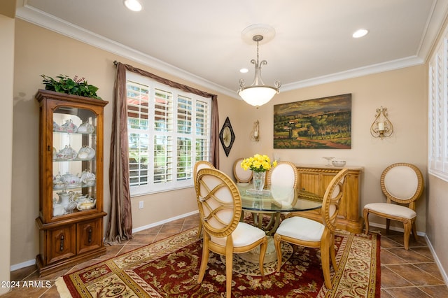 dining space featuring dark tile patterned floors, ornamental molding, baseboards, and recessed lighting