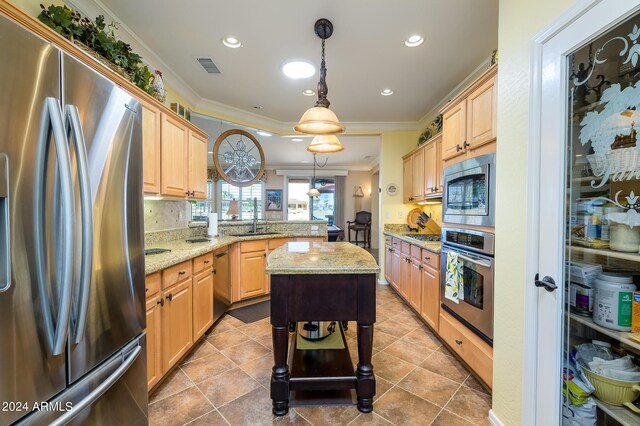 dining area with ornamental molding and dark tile patterned flooring