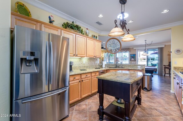 kitchen with light stone counters, ornamental molding, appliances with stainless steel finishes, and ceiling fan