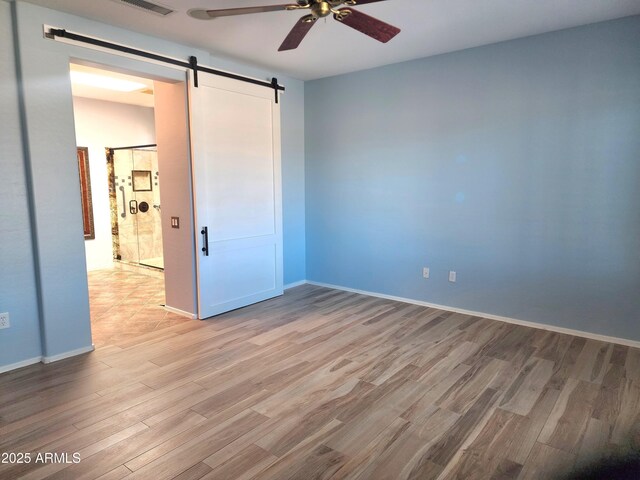 clothes washing area with cabinets, sink, dark tile patterned floors, and washer and clothes dryer