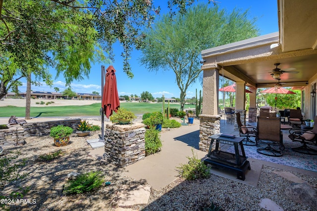 view of patio featuring a ceiling fan and outdoor dining space