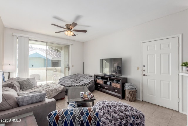 living room with ceiling fan and light tile patterned flooring