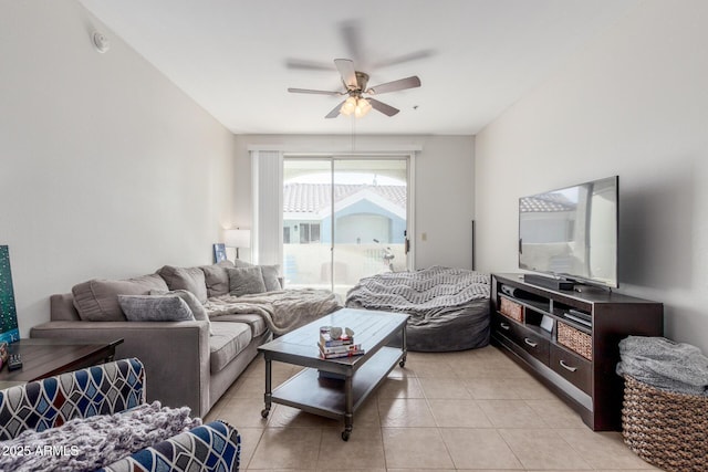 living room with ceiling fan and light tile patterned floors