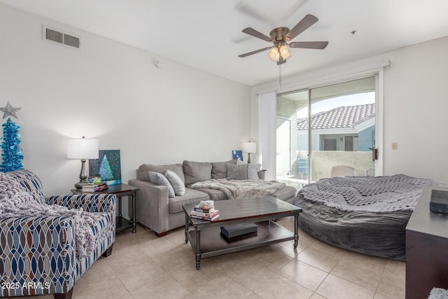 living room with ceiling fan and light tile patterned floors