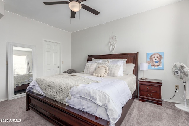 bedroom with ceiling fan and light carpet