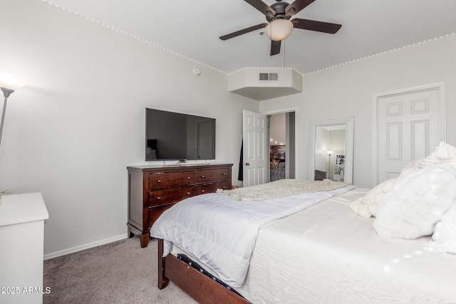 bedroom featuring ceiling fan and light carpet