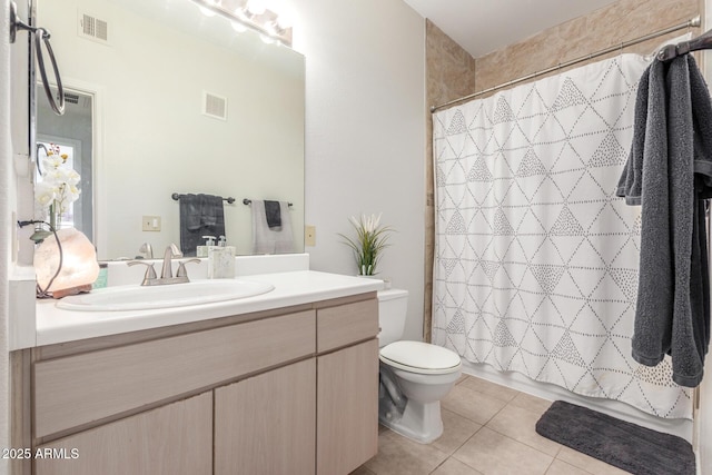 bathroom featuring tile patterned floors, a shower with curtain, vanity, and toilet