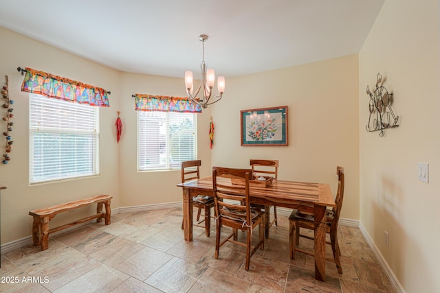 dining space with a notable chandelier