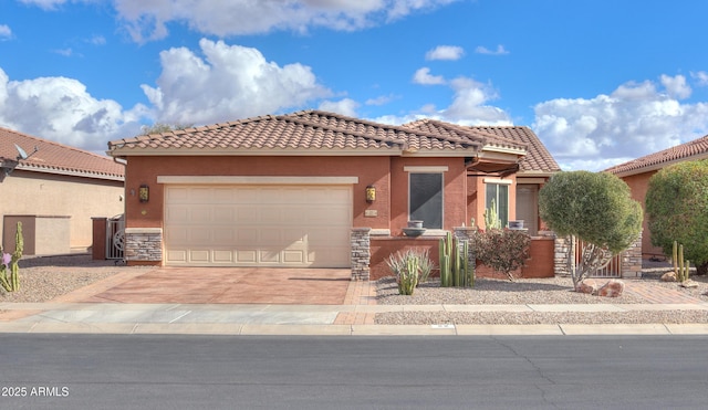 mediterranean / spanish-style house with a garage