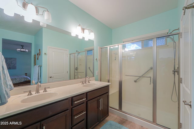 bathroom with vanity and a shower with shower door