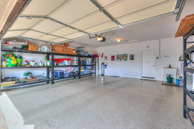 garage with sink and a garage door opener