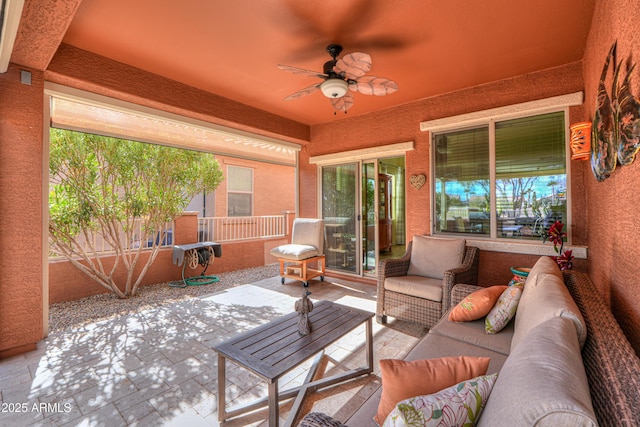 view of patio featuring outdoor lounge area and ceiling fan