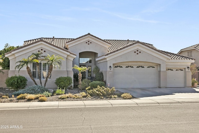 mediterranean / spanish home featuring a garage