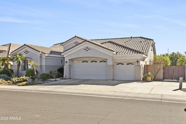 mediterranean / spanish-style house with a garage