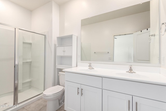 full bathroom featuring a sink, toilet, and a stall shower