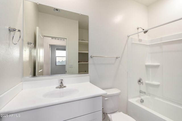 bathroom with visible vents, toilet, vanity, and shower / bathtub combination