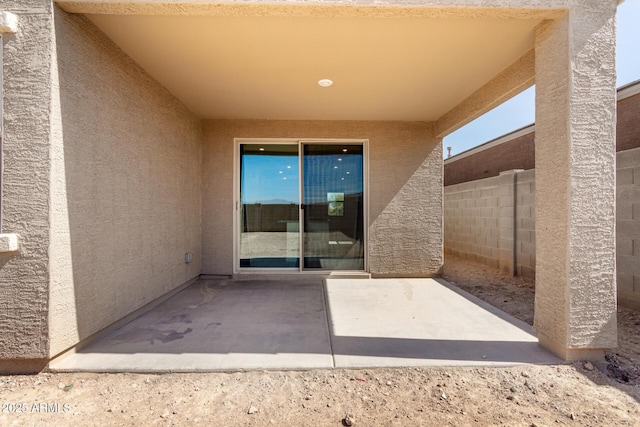 view of patio / terrace featuring fence