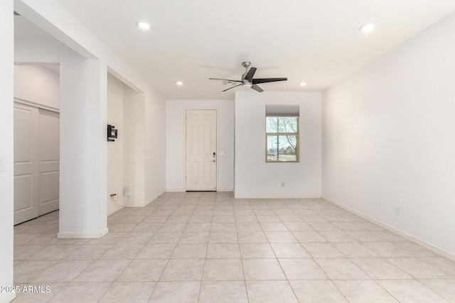 spare room featuring recessed lighting, baseboards, and a ceiling fan