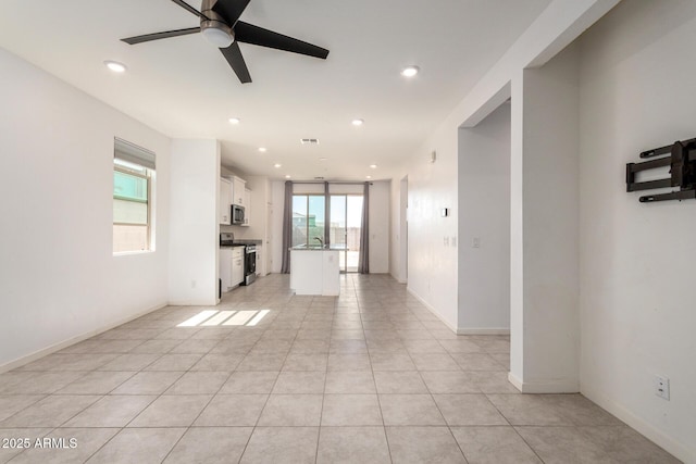 unfurnished living room with light tile patterned floors, recessed lighting, baseboards, and ceiling fan