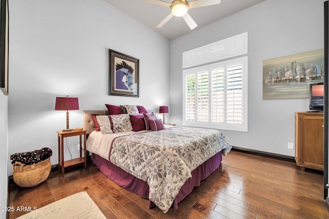 bedroom with dark wood-style flooring, ceiling fan, and baseboards