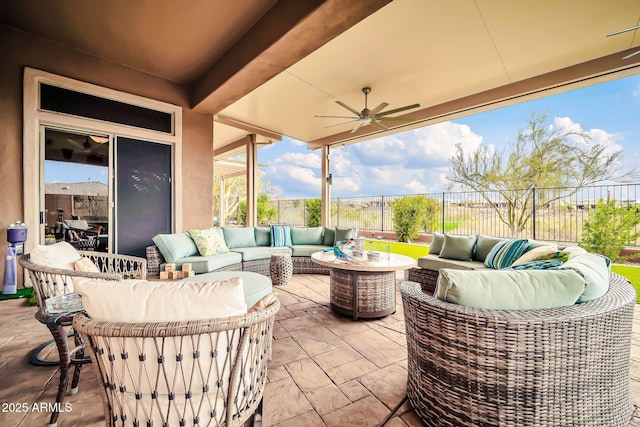 view of patio / terrace featuring a ceiling fan, fence, and an outdoor hangout area