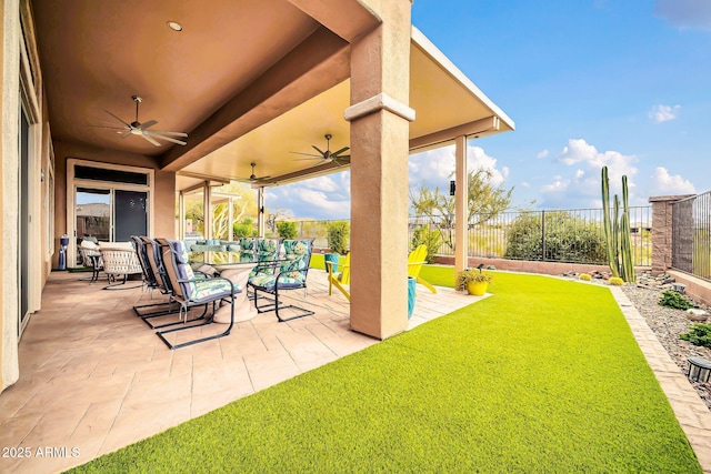 view of patio featuring a fenced backyard, ceiling fan, and outdoor dining space