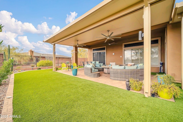 view of yard with a ceiling fan, a patio area, outdoor lounge area, and fence