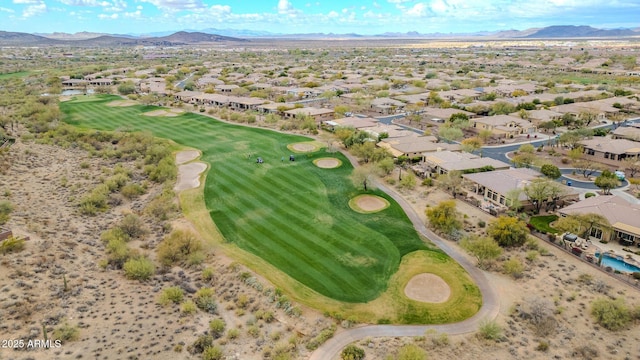 birds eye view of property with view of golf course, a residential view, and a mountain view