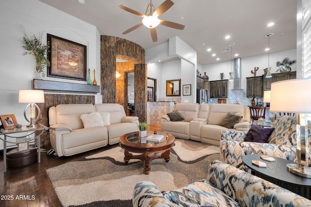 living area featuring visible vents, hardwood / wood-style floors, and recessed lighting