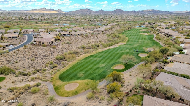 aerial view featuring view of golf course, a residential view, and a mountain view