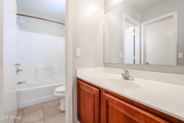 full bath with tile patterned floors, shower / washtub combination, toilet, and vanity