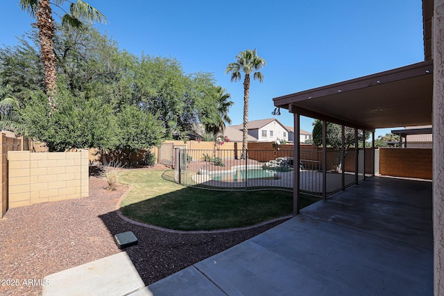 view of yard with a patio area and a fenced backyard