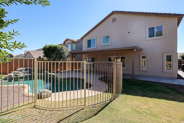 view of swimming pool featuring a fenced backyard, a fenced in pool, a lawn, and a patio