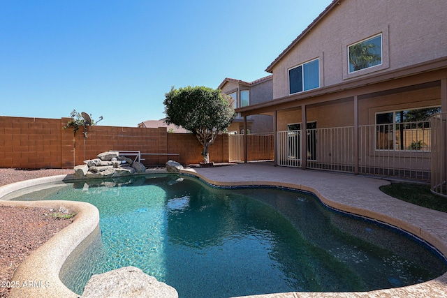 view of pool with a fenced in pool, a patio, and a fenced backyard