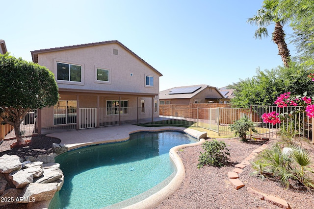 view of swimming pool with a fenced backyard, a fenced in pool, and a patio