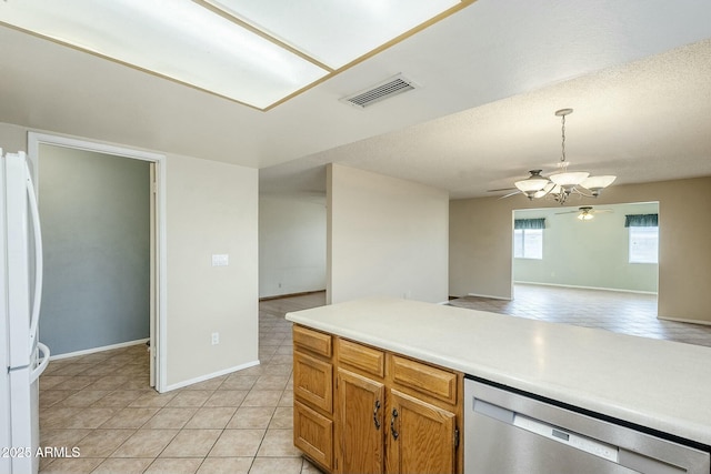 kitchen featuring visible vents, stainless steel dishwasher, open floor plan, freestanding refrigerator, and ceiling fan