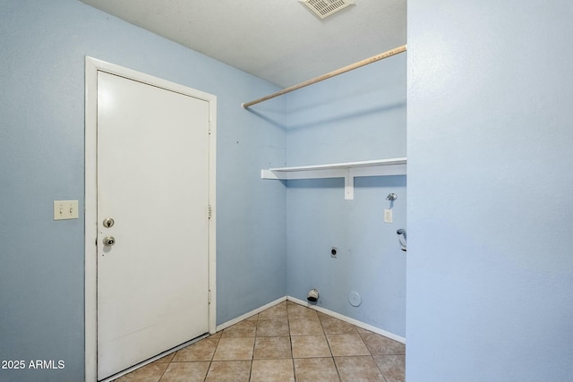 clothes washing area with electric dryer hookup, visible vents, tile patterned floors, hookup for a gas dryer, and laundry area