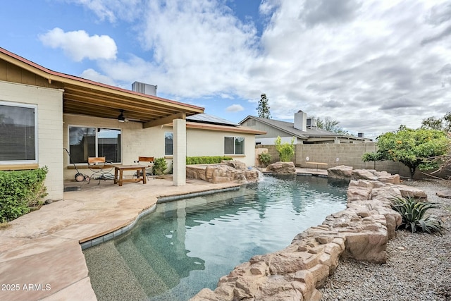 view of swimming pool with a patio area, a fenced in pool, a ceiling fan, and fence