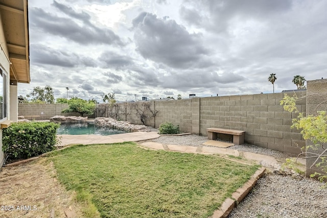 view of yard featuring a fenced in pool and a fenced backyard