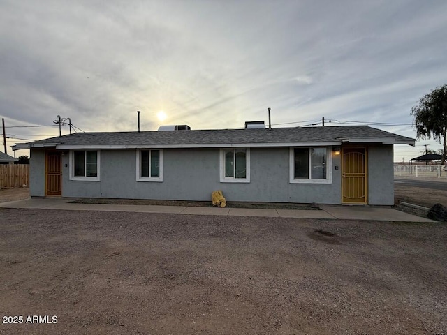 back of property with a patio