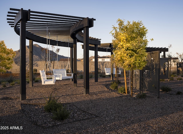 view of yard with a pergola and a mountain view