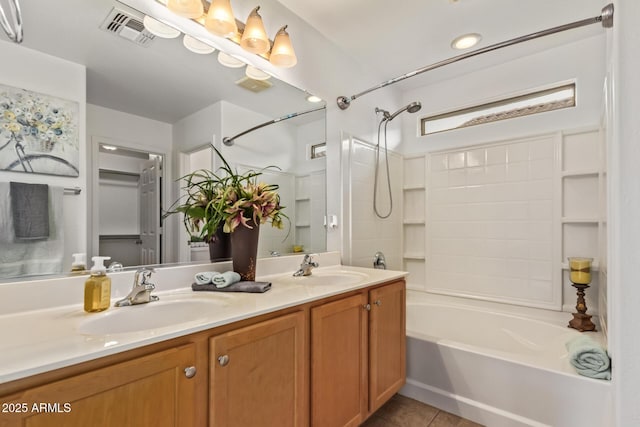 full bathroom with tile patterned floors, visible vents, shower / bathing tub combination, and a sink