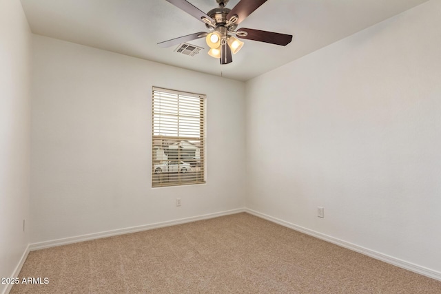 unfurnished room featuring baseboards, ceiling fan, visible vents, and light colored carpet